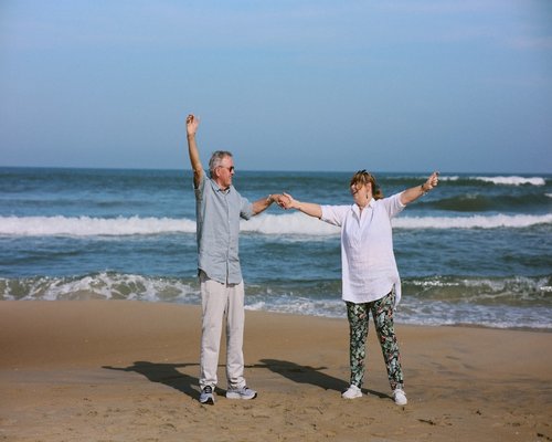 Senior couple doing light stretching exercises